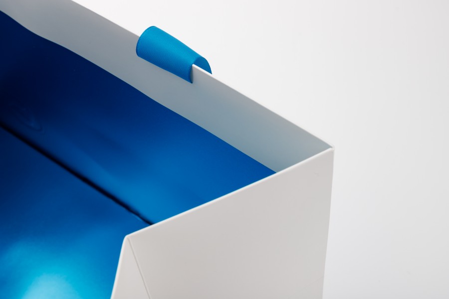 White Color Embossing logo Paper Bags with blue metal foil paper inside